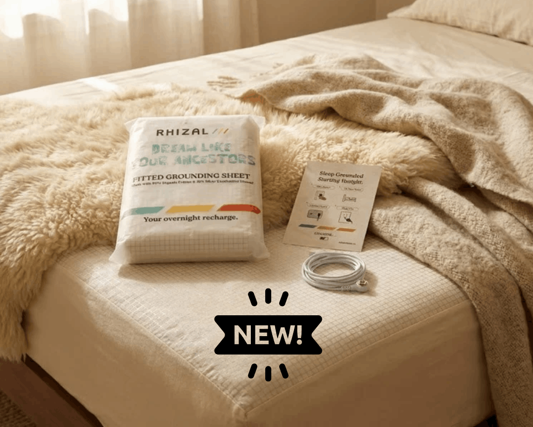 rhizal fitted grounding sheet on a mattress with packaging and blanket