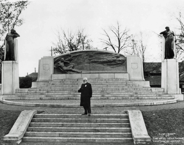 Alexander Graham Bell posing in front of the newly unveiled Bell Memorial