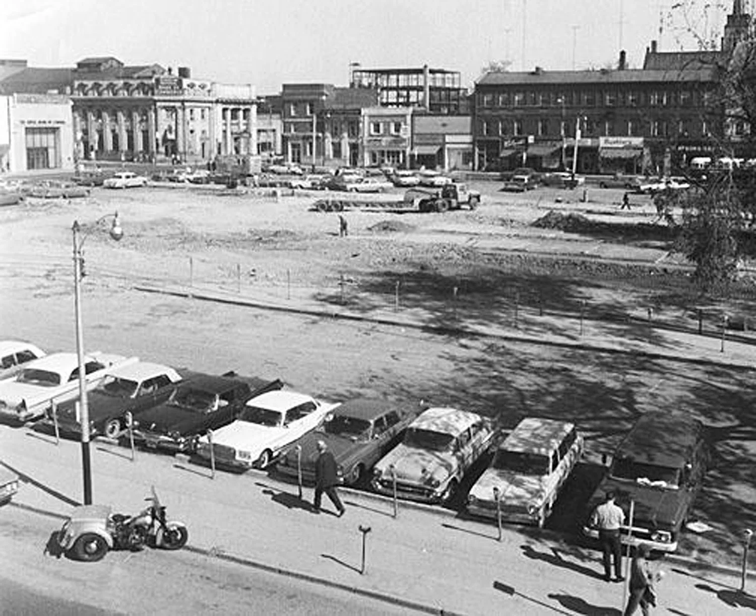Market Square, September-1965 after the demolition of City Hall. Looking north towards the corner of Dalhousie and Market Streets. The steel skeleton in the top centre of the picture is the new Canada Permanent Trust Building, now the downtown branch of the TD Canada Trust. Image courtesy of the Brant Historical Society