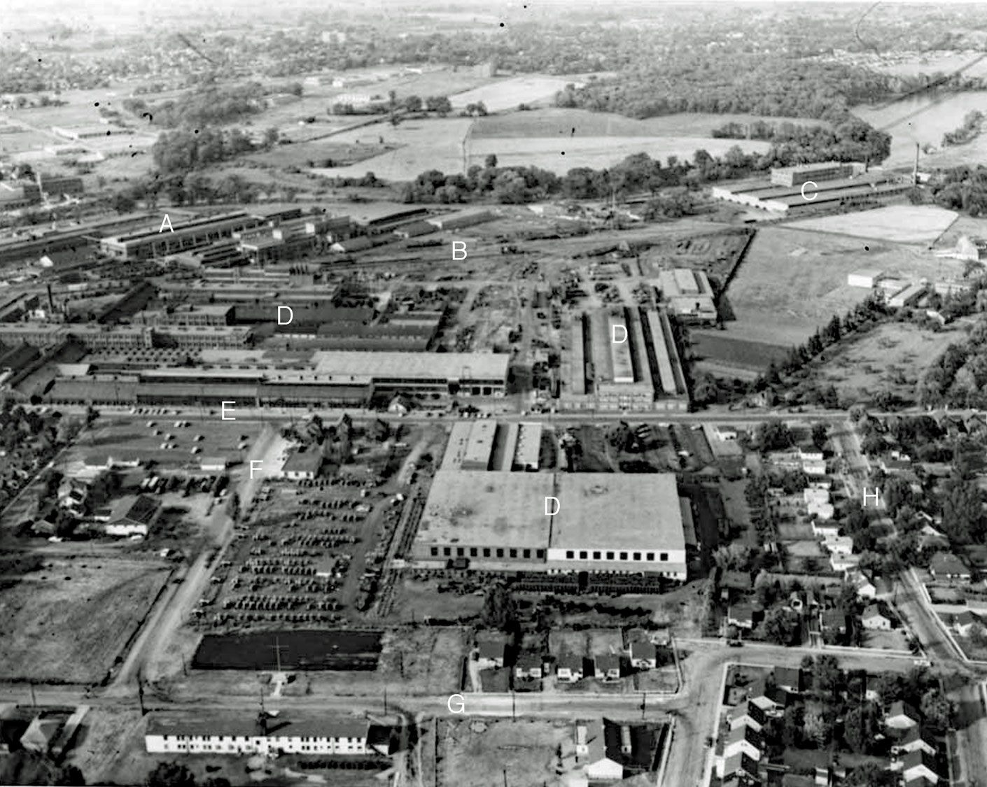 Aerial photo, Cockshutt complex Image courtesy of the Brant Historical Society A) Massey-Ferguson Verity Works, B) Toronto, Hamilton, & Buffalo (TH&B) Railway, C) Westinghouse Canada, television plant, D) Cockshutt complex, E) Mohawk Street, F) Harriett Street, G) Tom Street, H) Crandall Avenue.