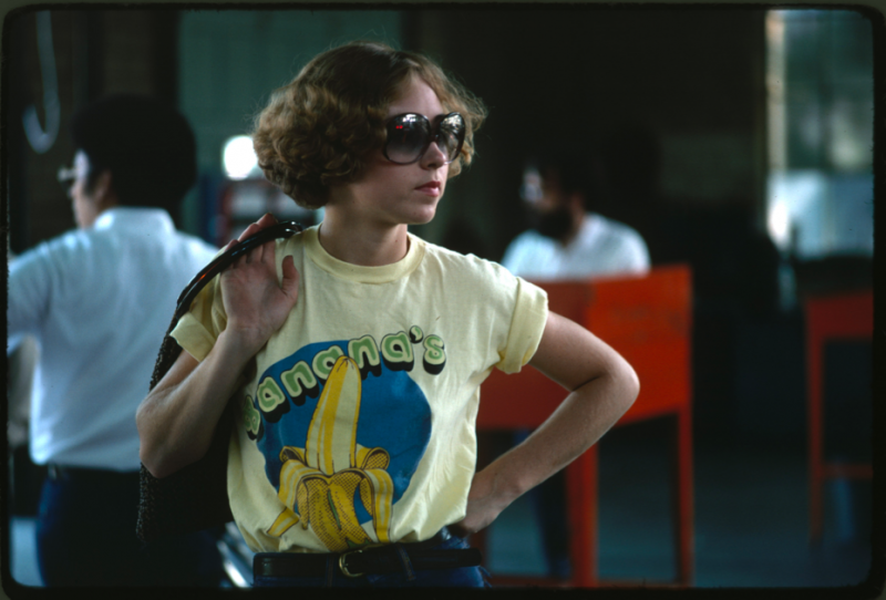 “Young woman watches as her car goes through testing at an auto emission inspection station in Downtown Cincinnati, Ohio. All light duty, spark ignition powered motor vehicles are tested annually for carbon monoxide and hydrocarbon emissions, and given a safety check. All other vehicles registered in the city receive an annual safety check. The emissions test on an exhaust analyzer went into effect in January 1975; the safety test has been in effect since 1940.” Lyntha Scott Eiler, Cincinnati, Ohio, September 1975 (412-DA-15451)