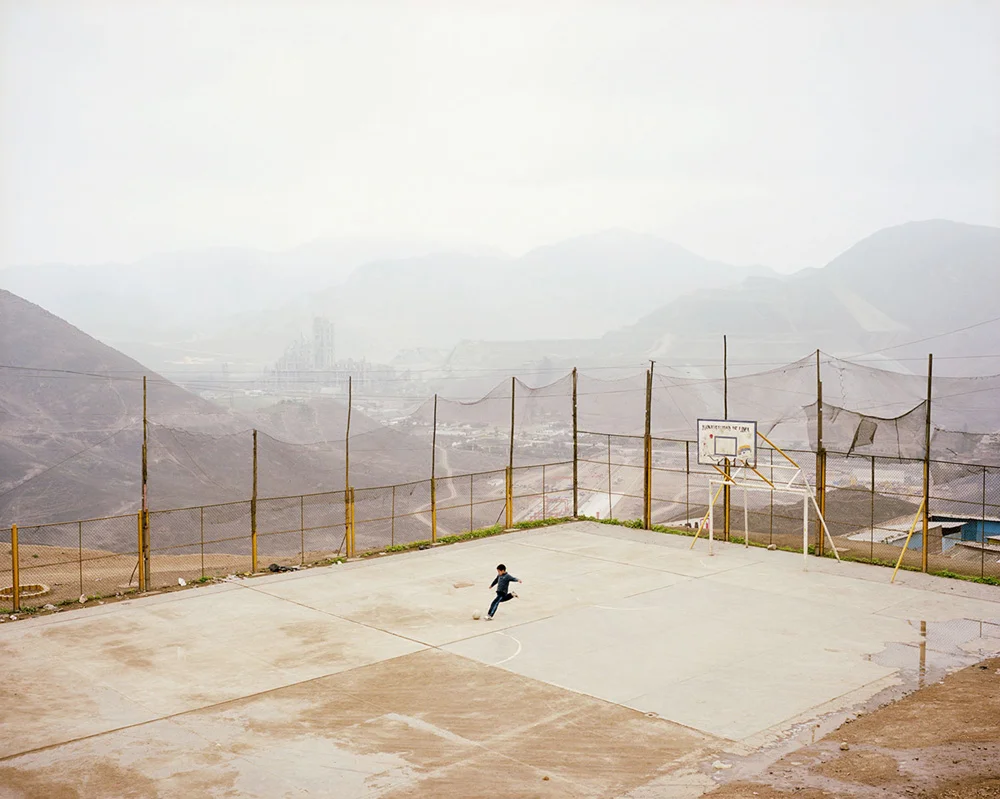 Luis Fernando Vasquez plays fútbol in the La Pradera Settlement; Lima.