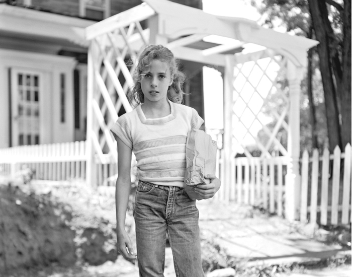 Girl Holding Brown Paper Bag by Christine Osinski