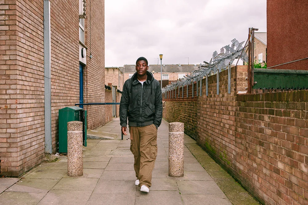Amos walking to the youth centre, Clapton, 2008 A gifted musician and big hearted teen, not long after this photo was taken Amos was kicked out of school over a silly incident with a firecracker, which caused him to be socially excluded and lead him down a risky path where he got involved in gang-related activity. Thankfully this was temporary, and he knows he's lucky to have avoided anything bad happening to him. "It was hard for us young black boys, a lot of us didn't really believe that we could do more."