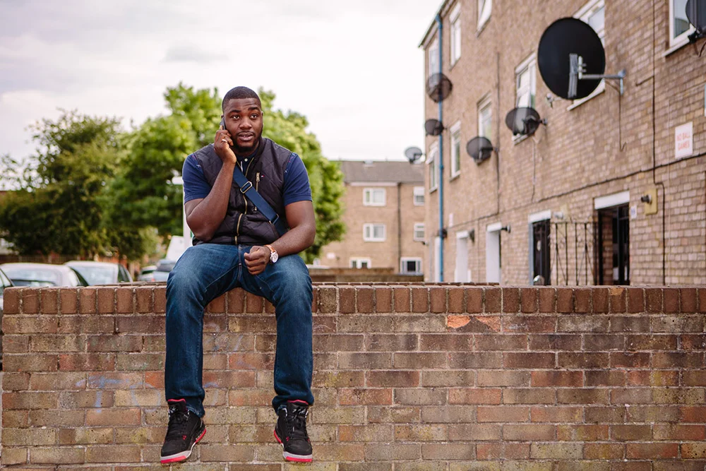 Amos on the phone, Clapton, 2015 Looking at the old photos, we realized it was exactly seven years to the day that I photographed Amos last time, he told me how in 2008 he'd been on the verge of a turning point for worse back then, and this time he's at a turning point for the better. He has a positive outlook and is working to secure his dreams. Working two jobs one as a musician for church events where he's "more spiritual than religious" and another as a bouncer in clubs he is in the process of setting up his own security firm. 