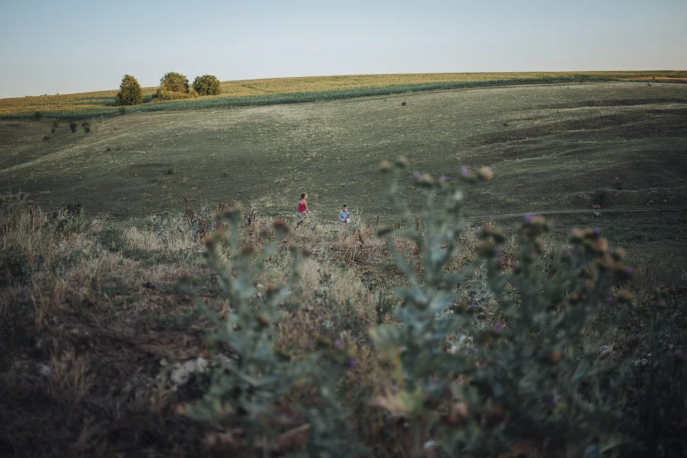 The outskirts of Rotari village. Children waiting for the cows to come back from the pasture in the evening. 