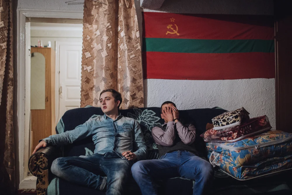 Alyosha and Yura are sitting under the flag of Transnistria. 