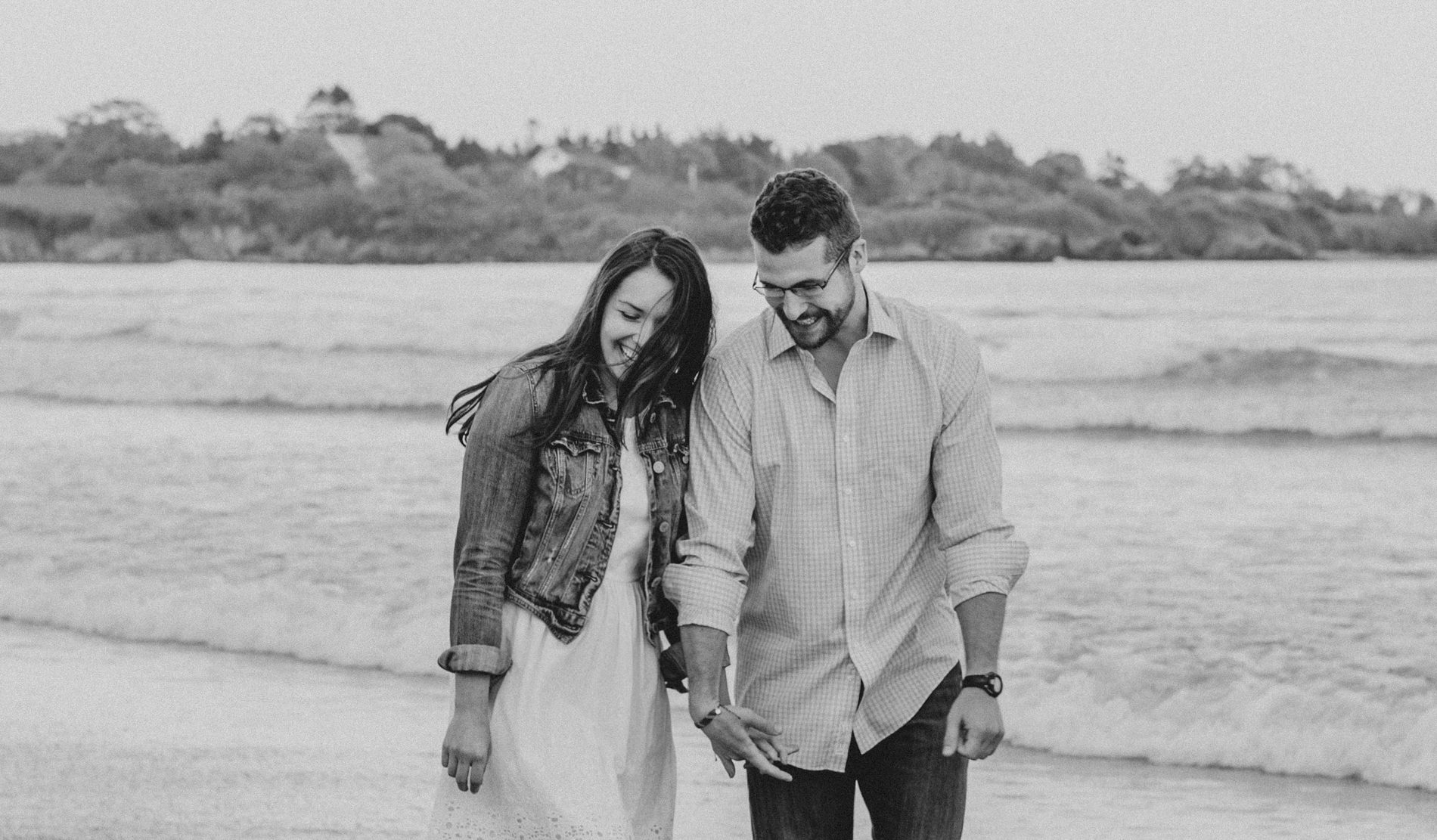  couple laughing during their maine engagement photos 