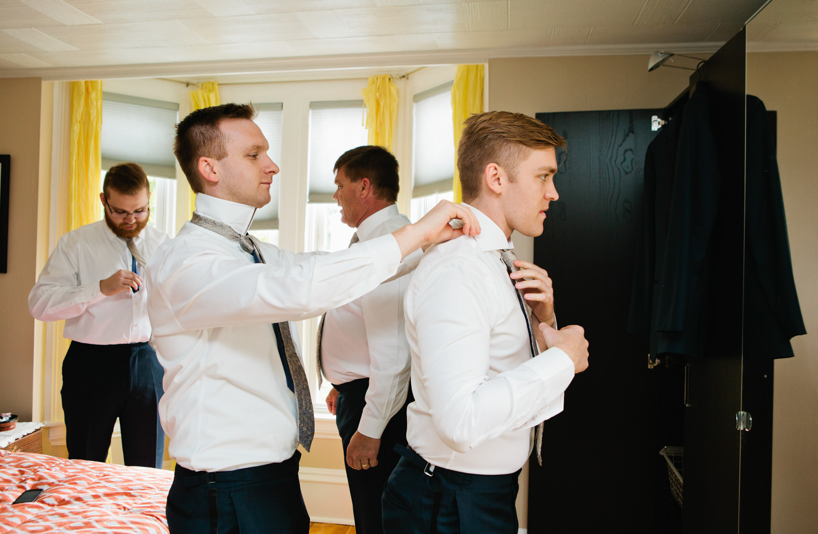 a groom gets dressed for his wedding