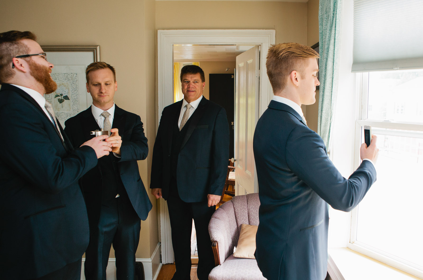 a groom takes a selfie before his maine wedding