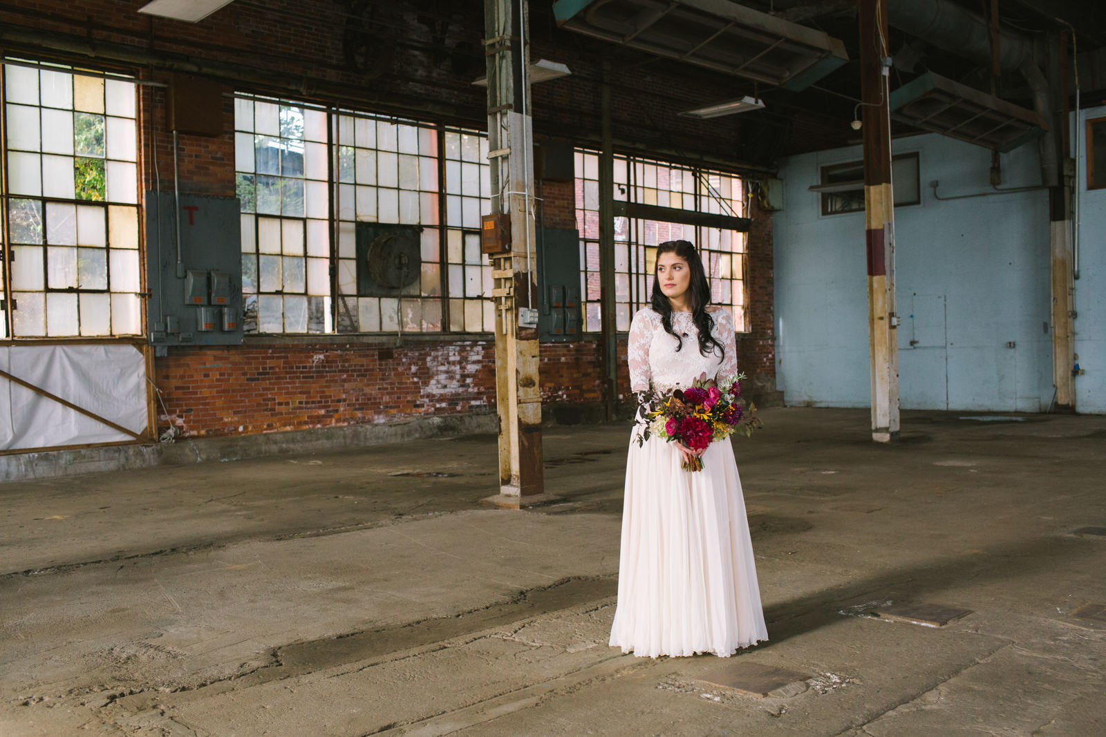 a bride at 58 fore in portland maine with her bouquet