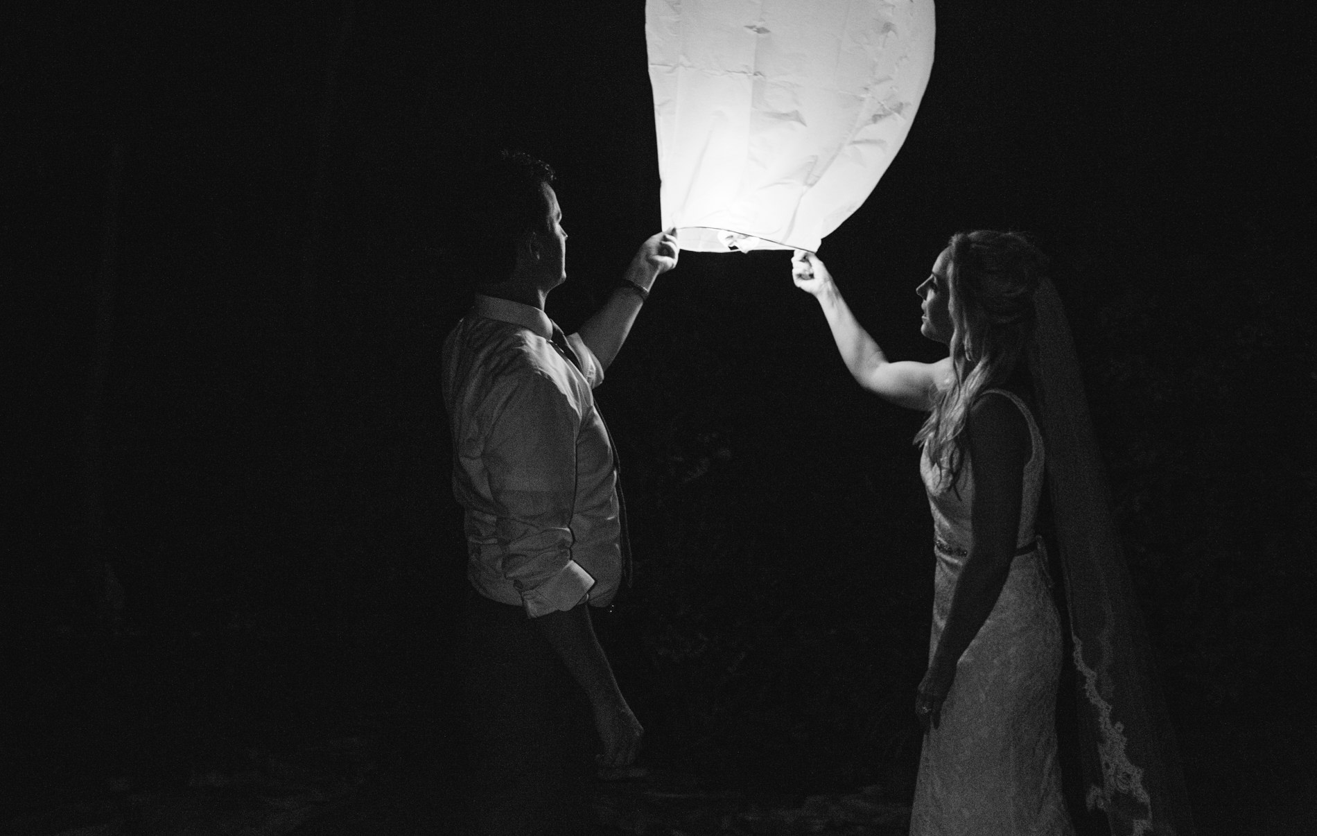  bride and groom launch a lantern 