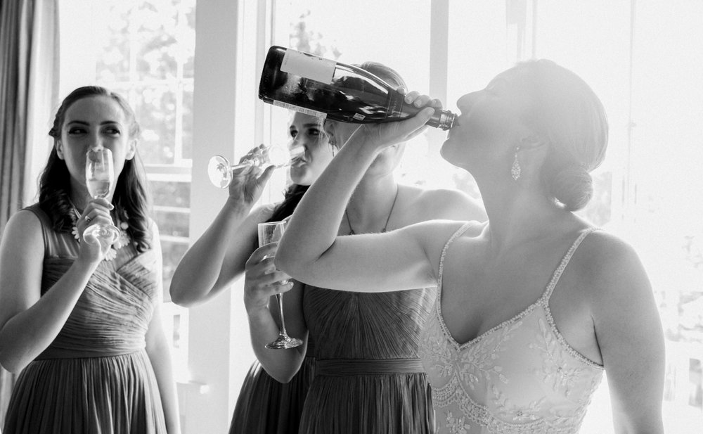  A bride drinks wine before her wedding 