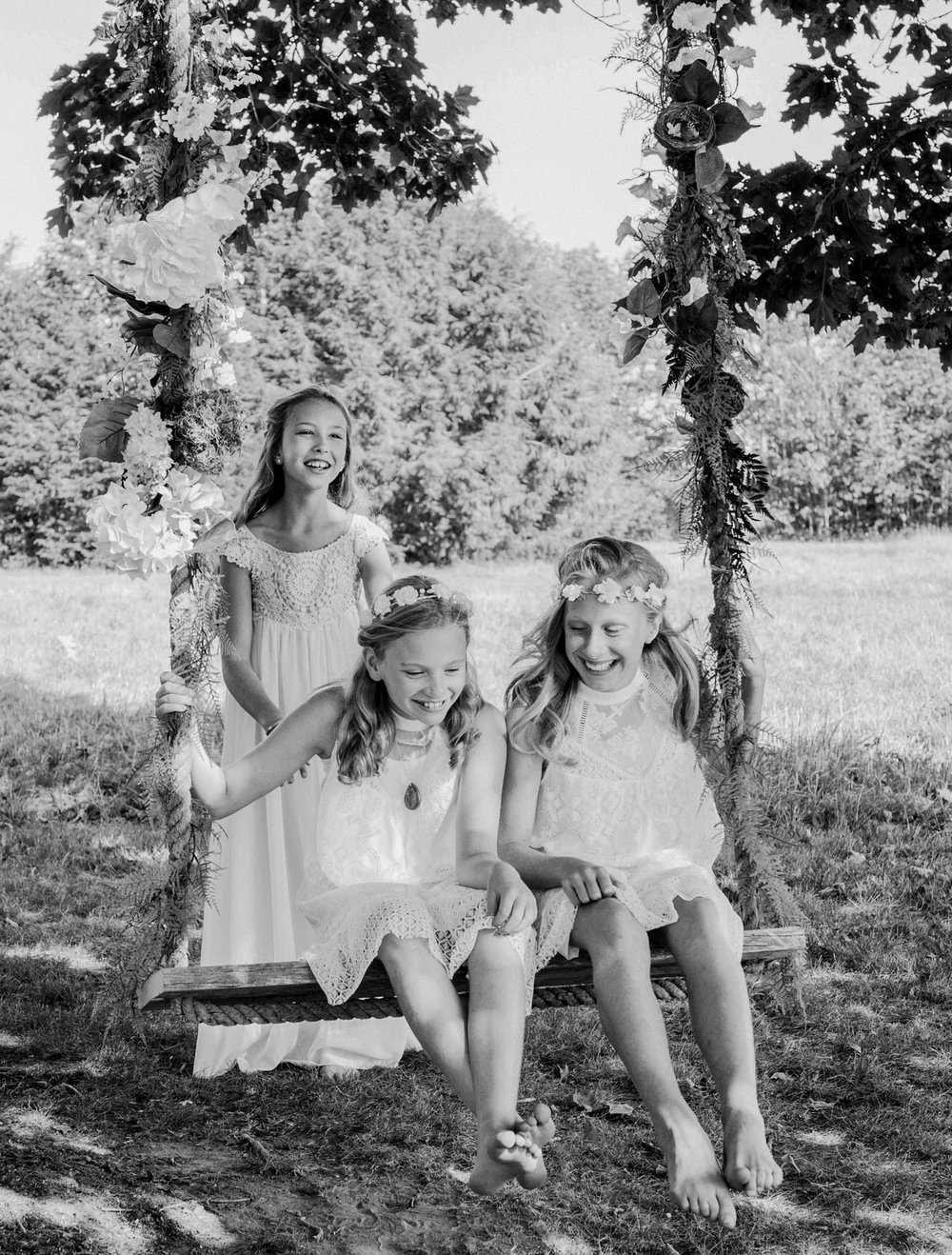 flower girls on a swing