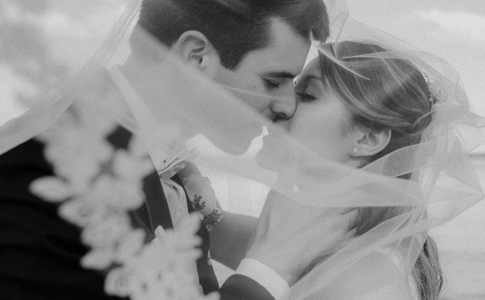 bride and groom kiss