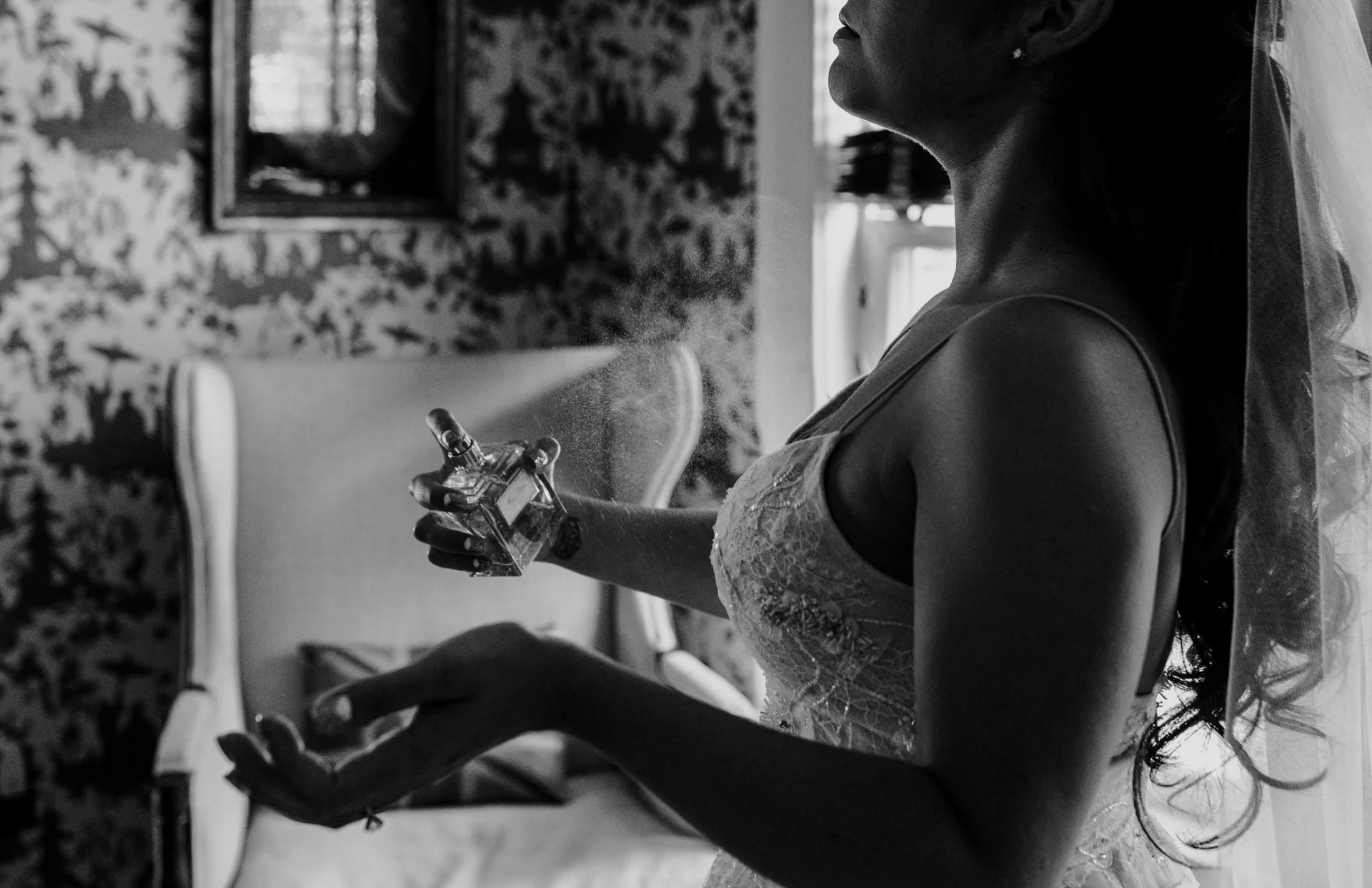 A bride puts on perfume 