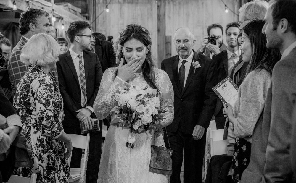  An emotional bride walks down the aisle 