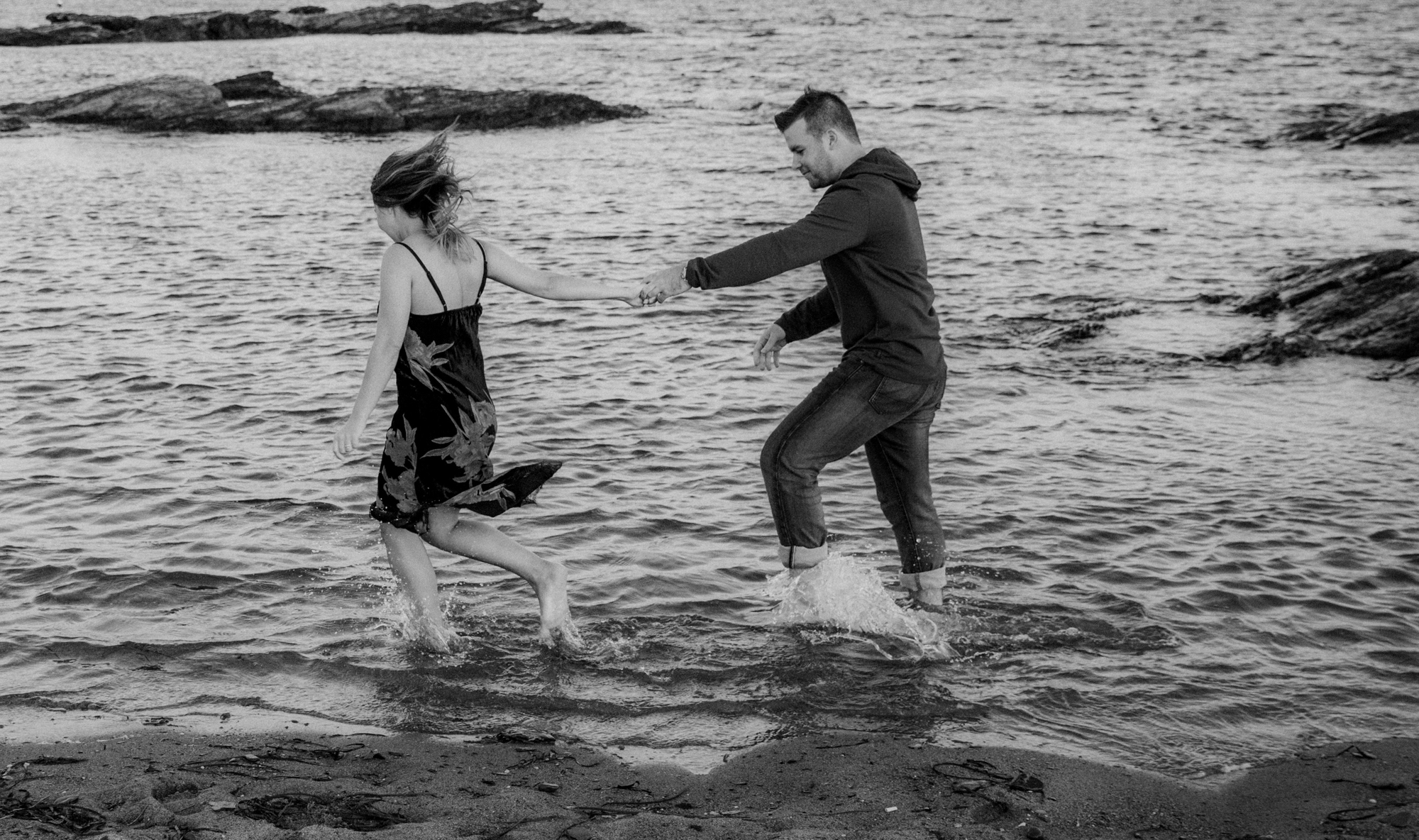  A couple runs in the ocean 