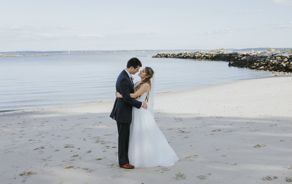  A couple at the beach on their wedding day 