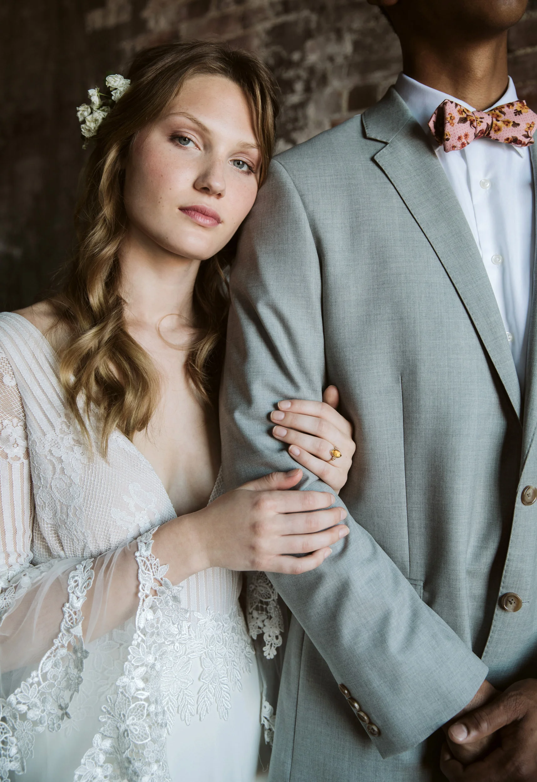 Close up of bride leaning on groom's shoulder