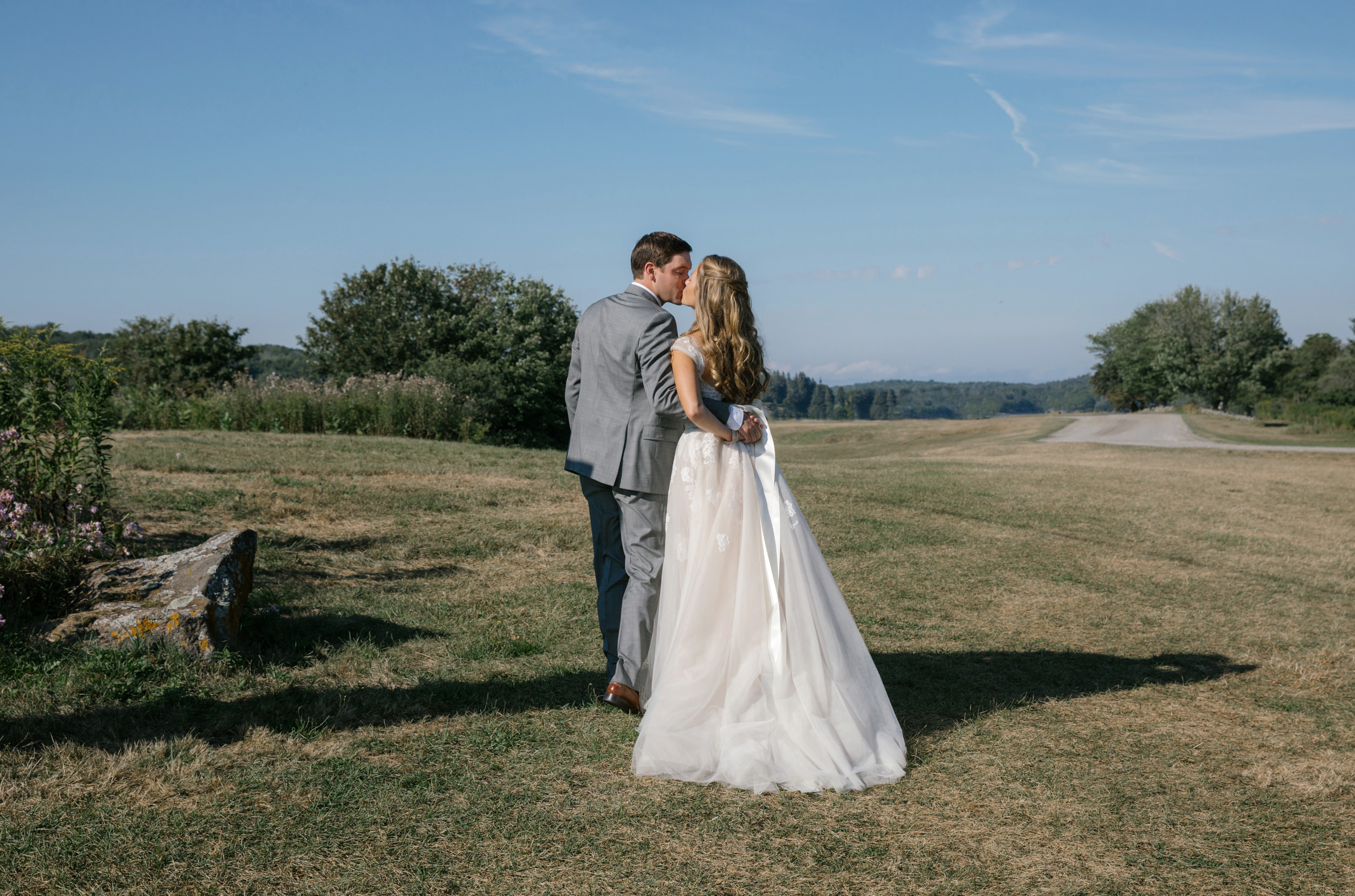  Bride and groom kissing after their wedding ceremony during a private moment 