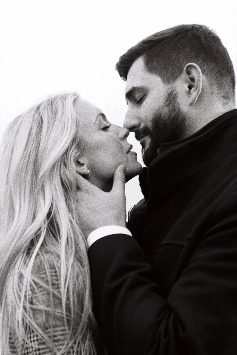 A couple almost kissing in black and white film 