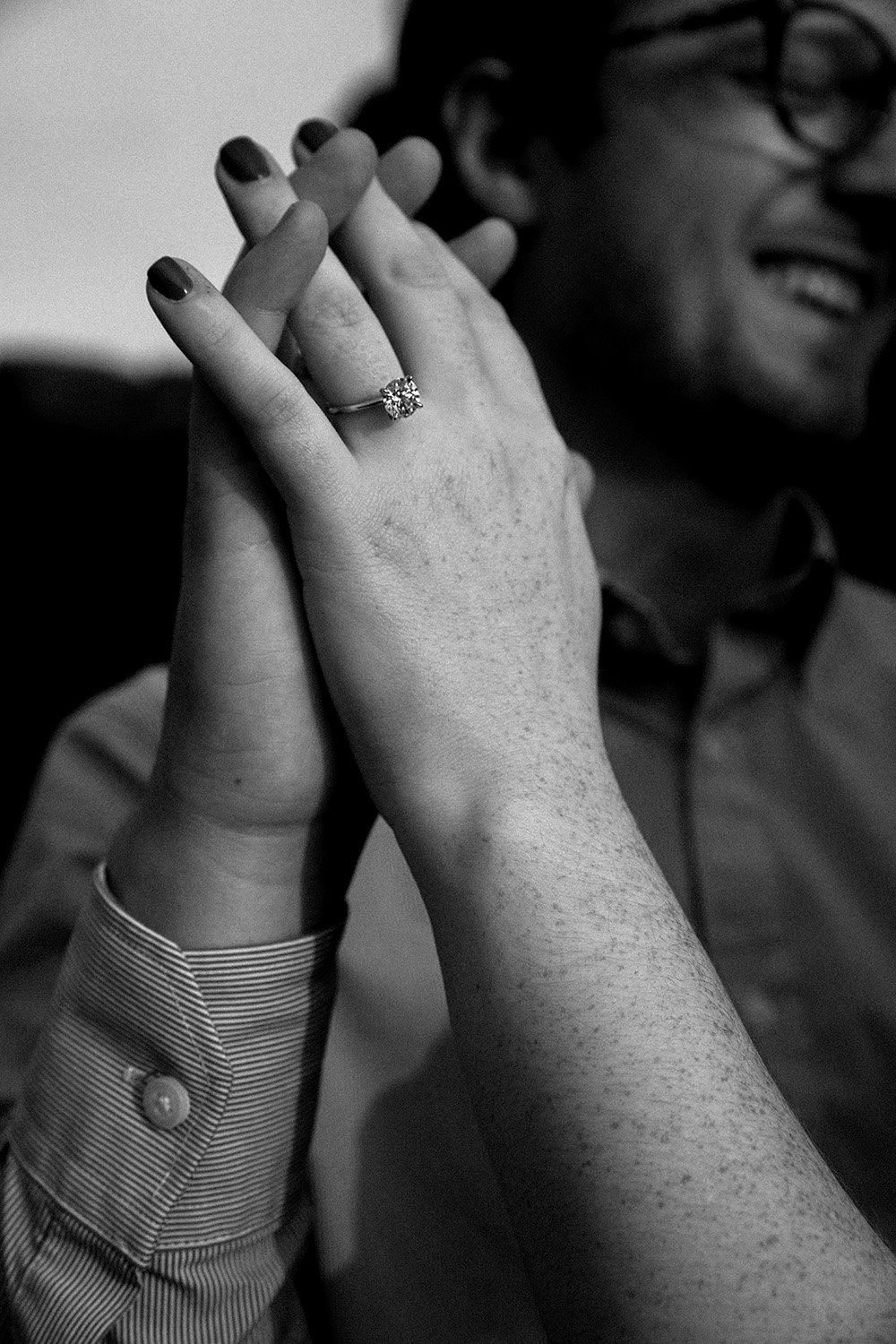 a close up photo of a ring on a newly proposed woman