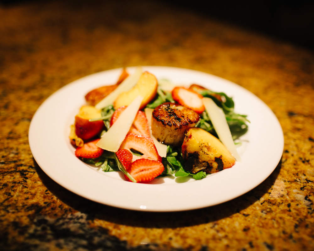    Seared scallop salad with grilled peaches, strawberries, shaved pecorino toscano, and &nbsp;peach balsamic vinaigrette   