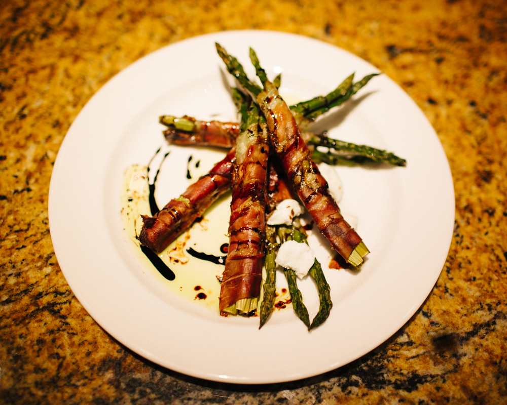    Prosciutto wrapped asparagus with balsamic reduction, goat cheese, and white truffle oil   