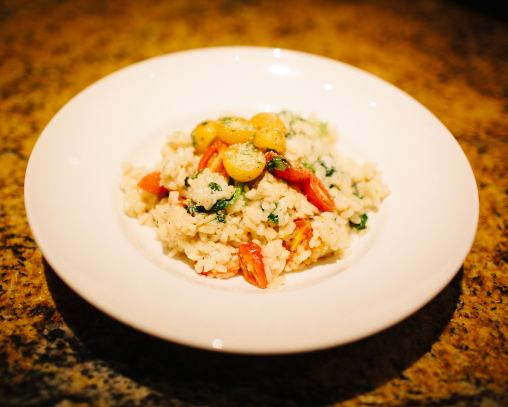    Basil Parmesan risotto with red and yellow grape tomatoes   