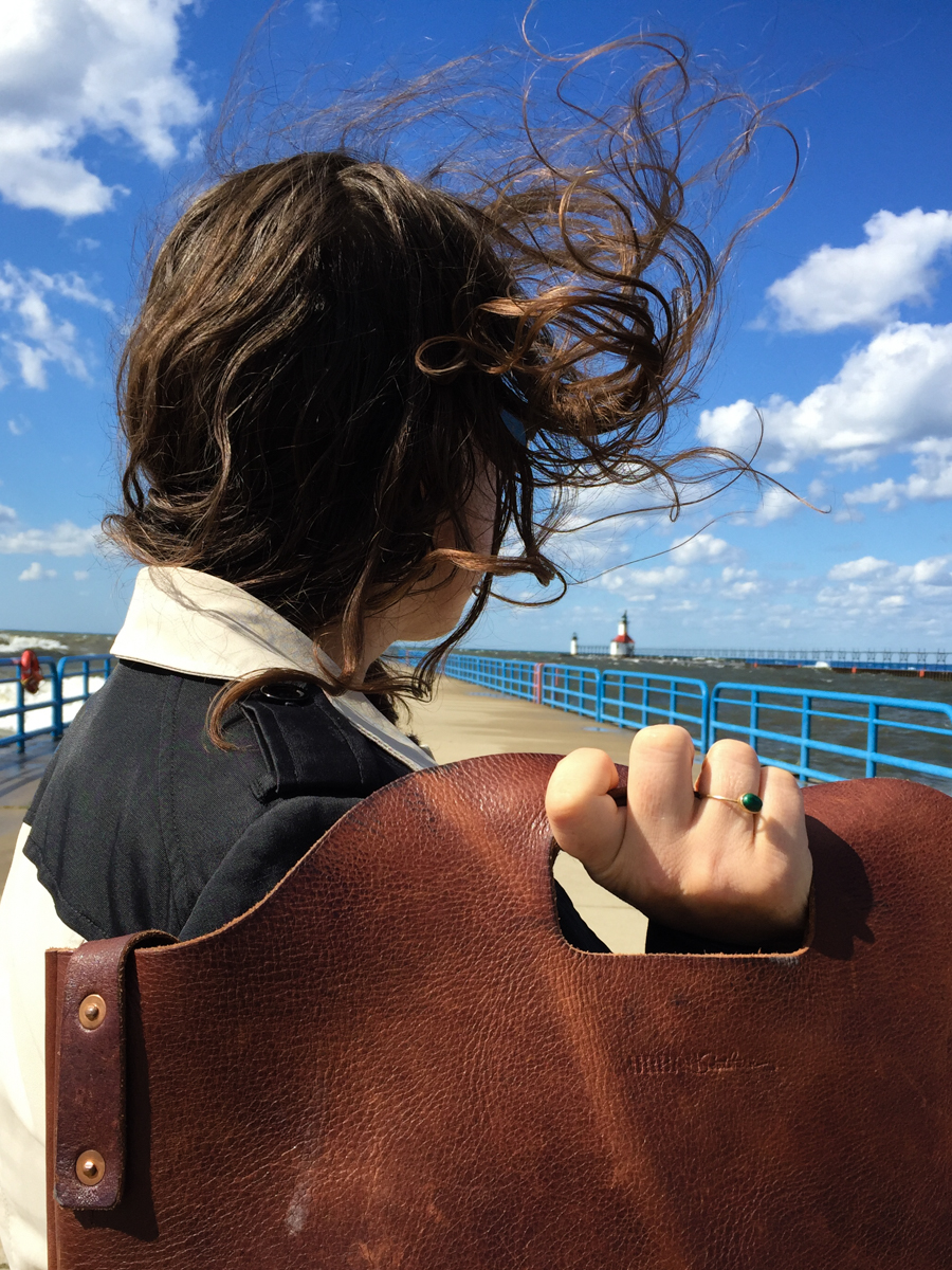 The autumn wind whipping my hair around. I had to take off the hat or hold it on constantly if I wanted to keep it for future wear and not to provide a new hat for the sea gulls.