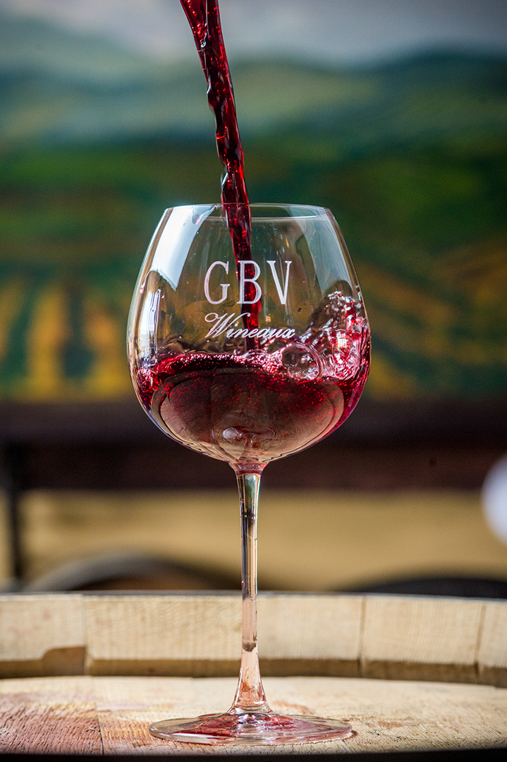 Our red wine displaying a beautiful full color while being poured into a GBV glass.