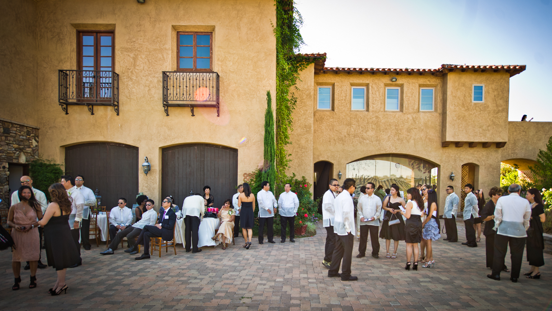 Guests gather near the front entrance prior to a wedding ceremony.