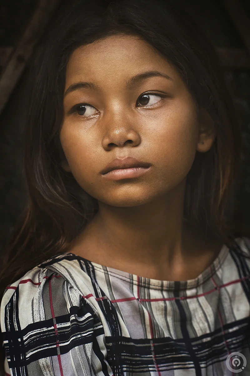 03202014-Seth-in-front-of-her-home-Antejet-Village-Battambang-Cambodia-Logo.jpg
