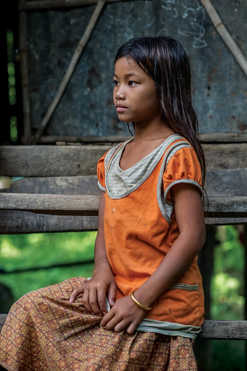 09272012-Seth-sitting-at-home-vertical-Antejet-Village-Battambang-Cambodia-cutdown.jpg