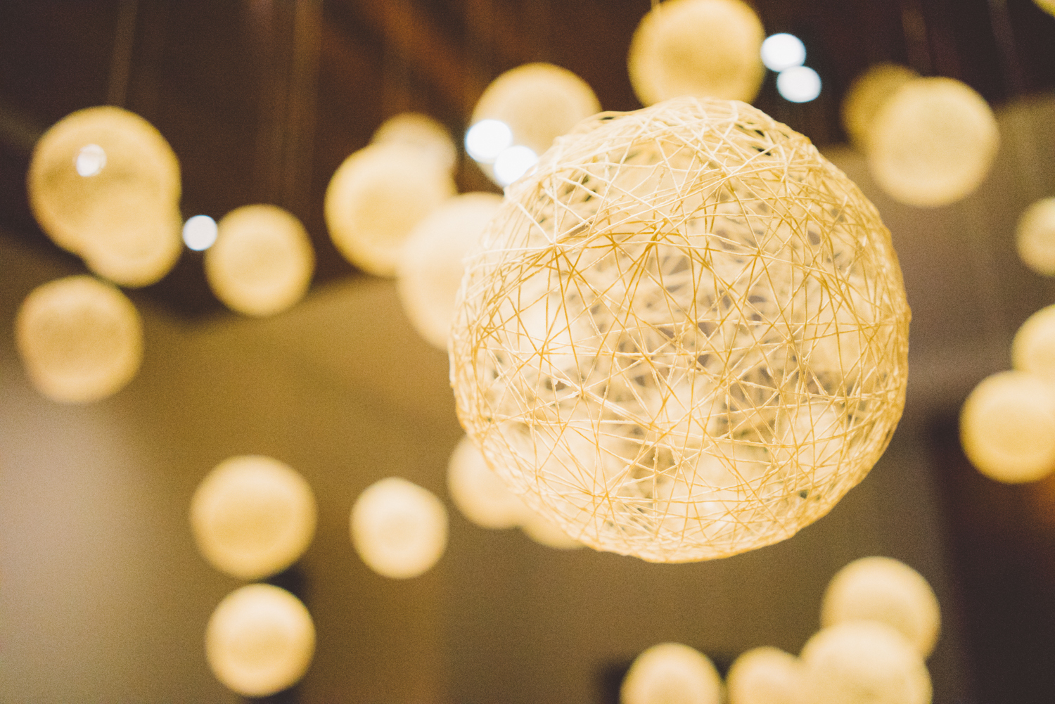 Hollow string balls hang over reception on the way out.