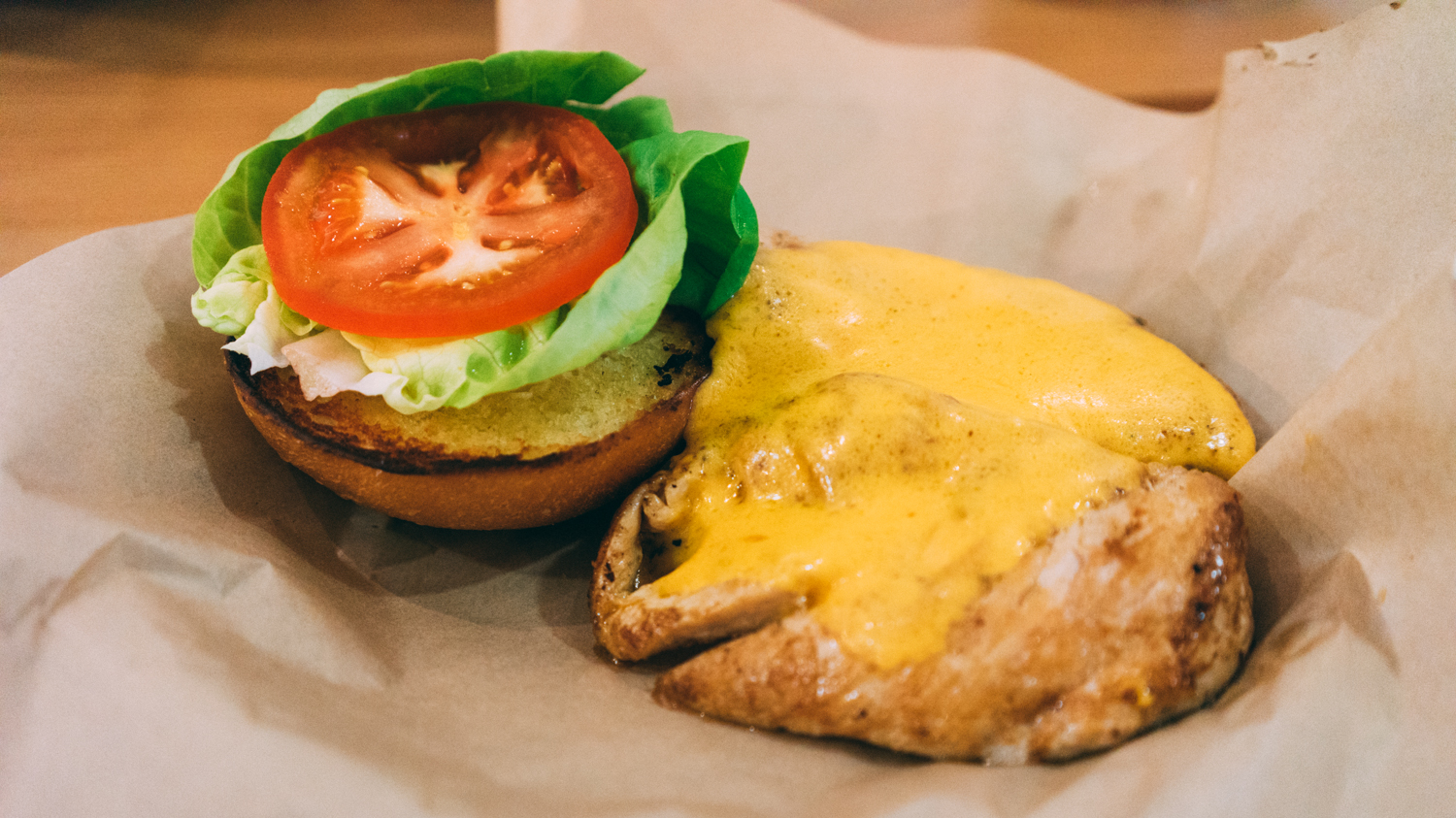 Leoda's burger (chicken breast in lue of beef) topped with fresh veg.