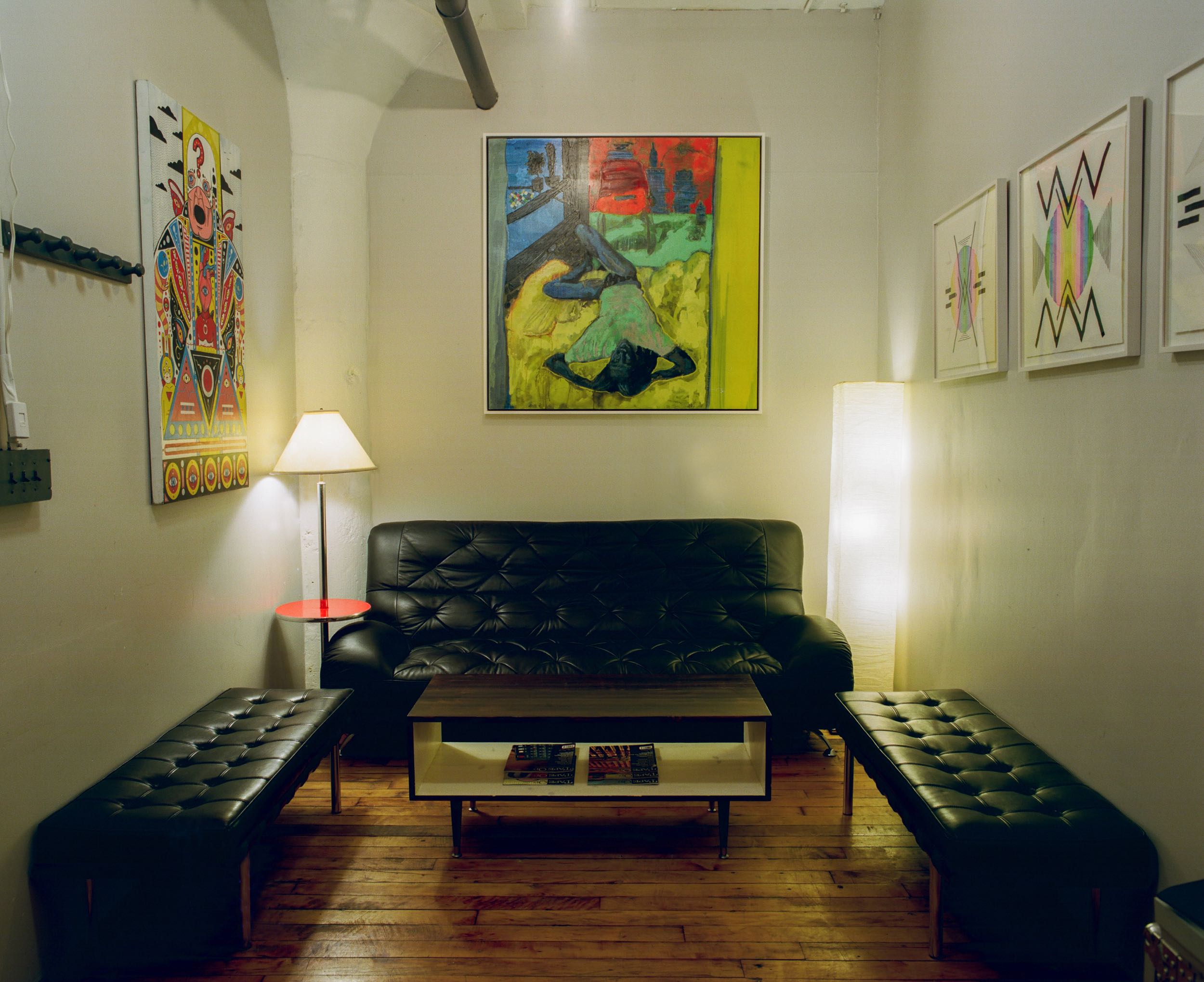 Lounge and Reception Area of Look to Listen Studios leather couches and artwork by Drjuchin and Castator