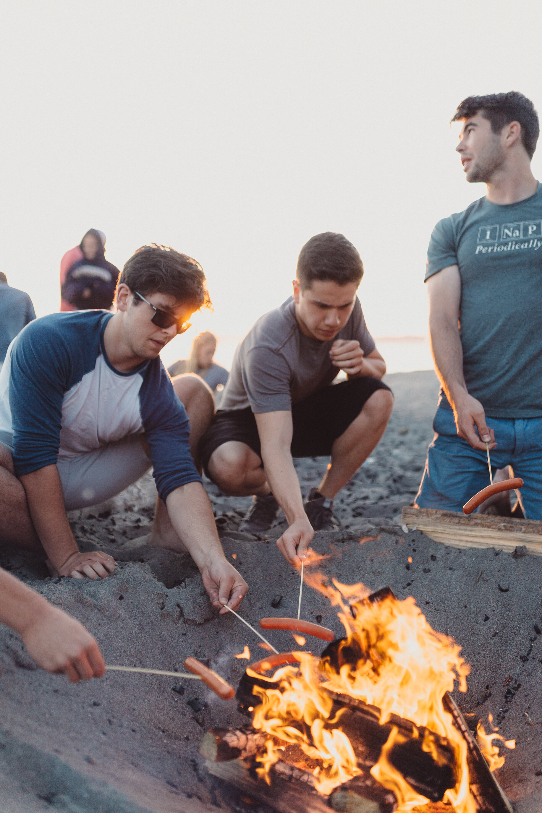 Guys around fire cooking.jpg