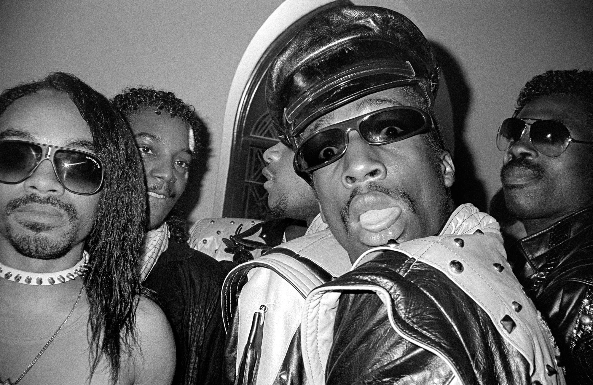 Hip-hop recording artist DJ Grandmaster Flash with friends at the Apollo Theater. (1985)