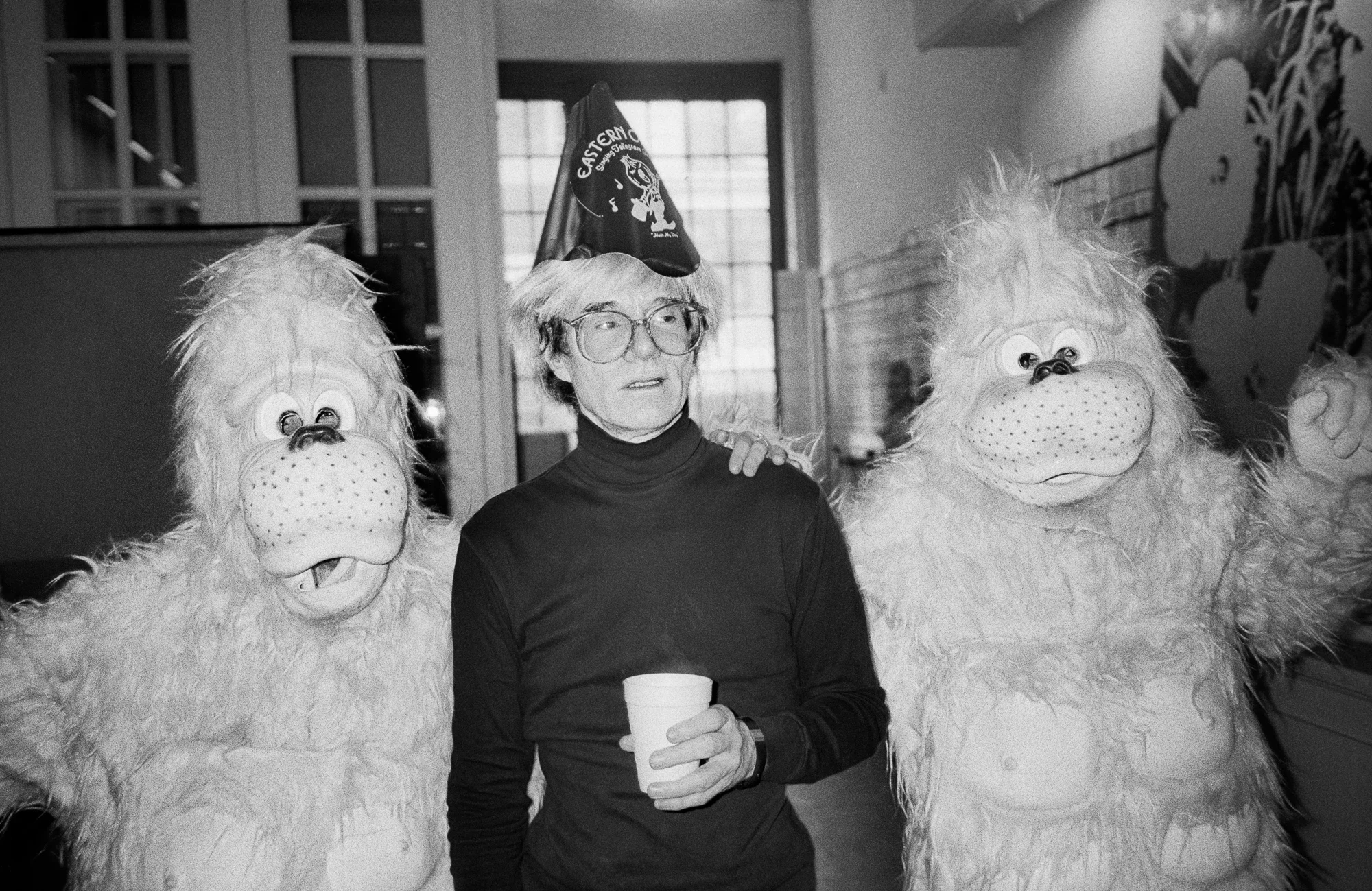 Andy Warhol’s birthday with pink orangutans the designer Halston sent over to surprise him for his birthday. (1985)