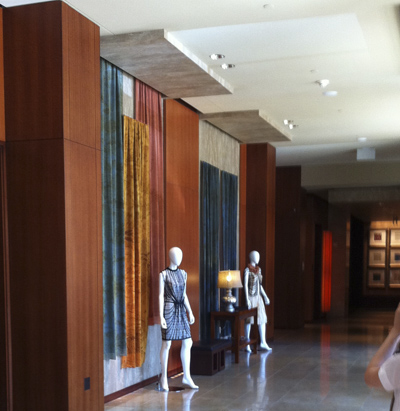 Here is our first lobby scene. With the help of interior designer Julie Jomo , we hung yards of hand printed fabric which swayed with the movement of passers by to the delight of hotel guests . Two mannequins always wore our current designs, here are our Identity pieces from our launch runway show at Lincoln Center Sept 2009.