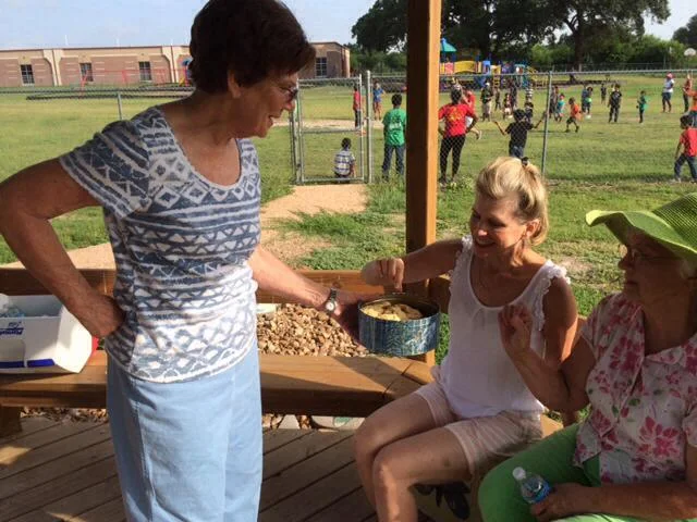 Debbie Urquhart and Carolyn Sander taking a break after a long morning in the butterfly garden. Ann Lehmann kindly brought cookies for a mid-morning break.
