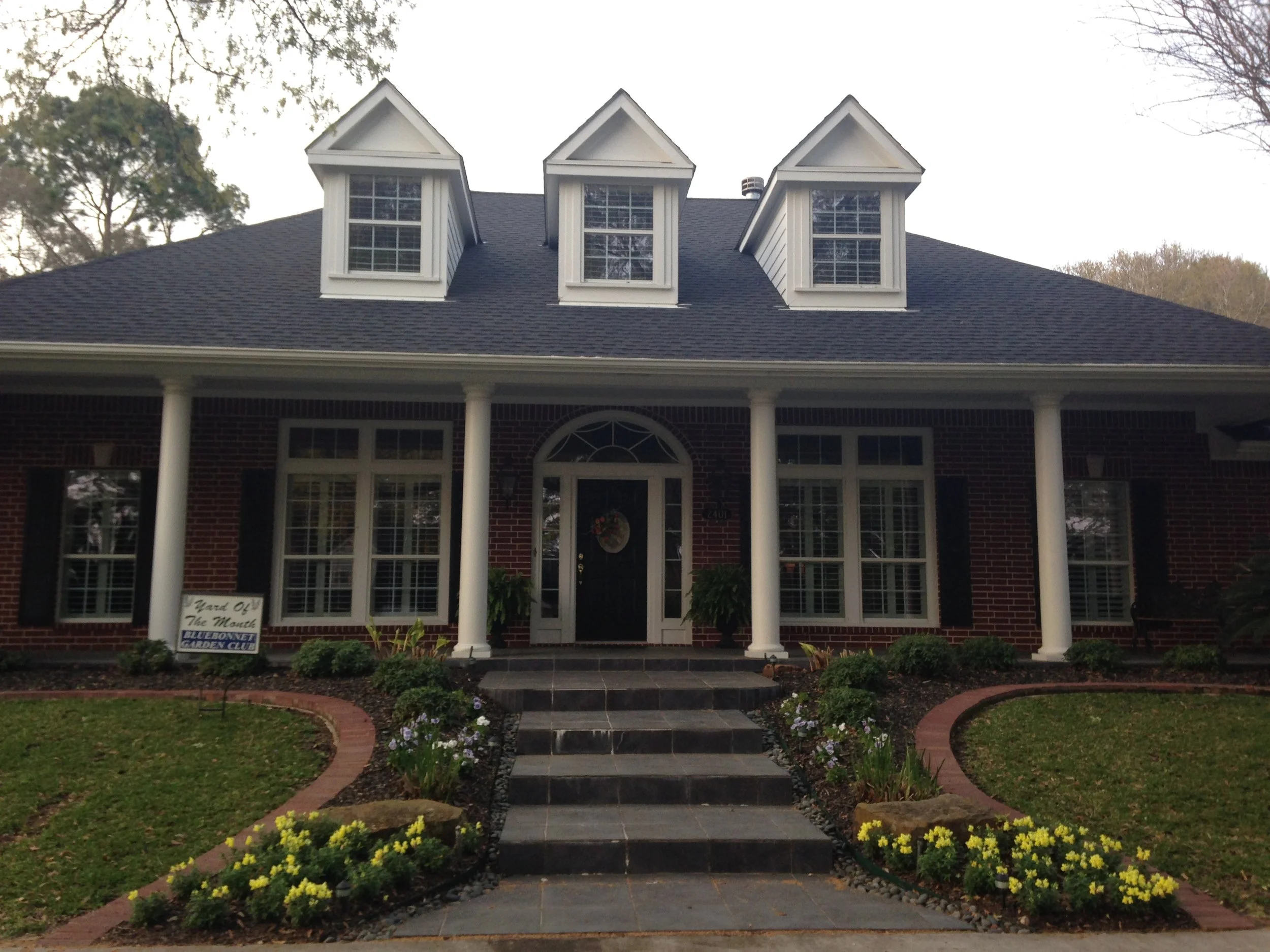 Bluebonnet Garden Club awarded the March Yard of the Month to Rodney and Cindy Foerster at 2401 Rosedale. Framing the front door of their southern style home are two lush Boston ferns. On either side of the elegant entry walkway are yellow pansies, snapdragons, dwarf pittosporum and African iris. Completing the front and side of this pristine yard are sego palm, white crepe myrtle, roses, encore azaleas and Lorapetalum. Providing privacy for the back yard is a large attractive hedge of elaeagnus plants. Nestled against the back of the house, a flowing fountain sits on a brick patio, bordered by dusty miller and edged with river rock.
