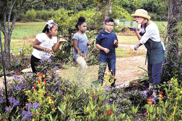 Debbie Urquhart in Butterfly Garden.jpg