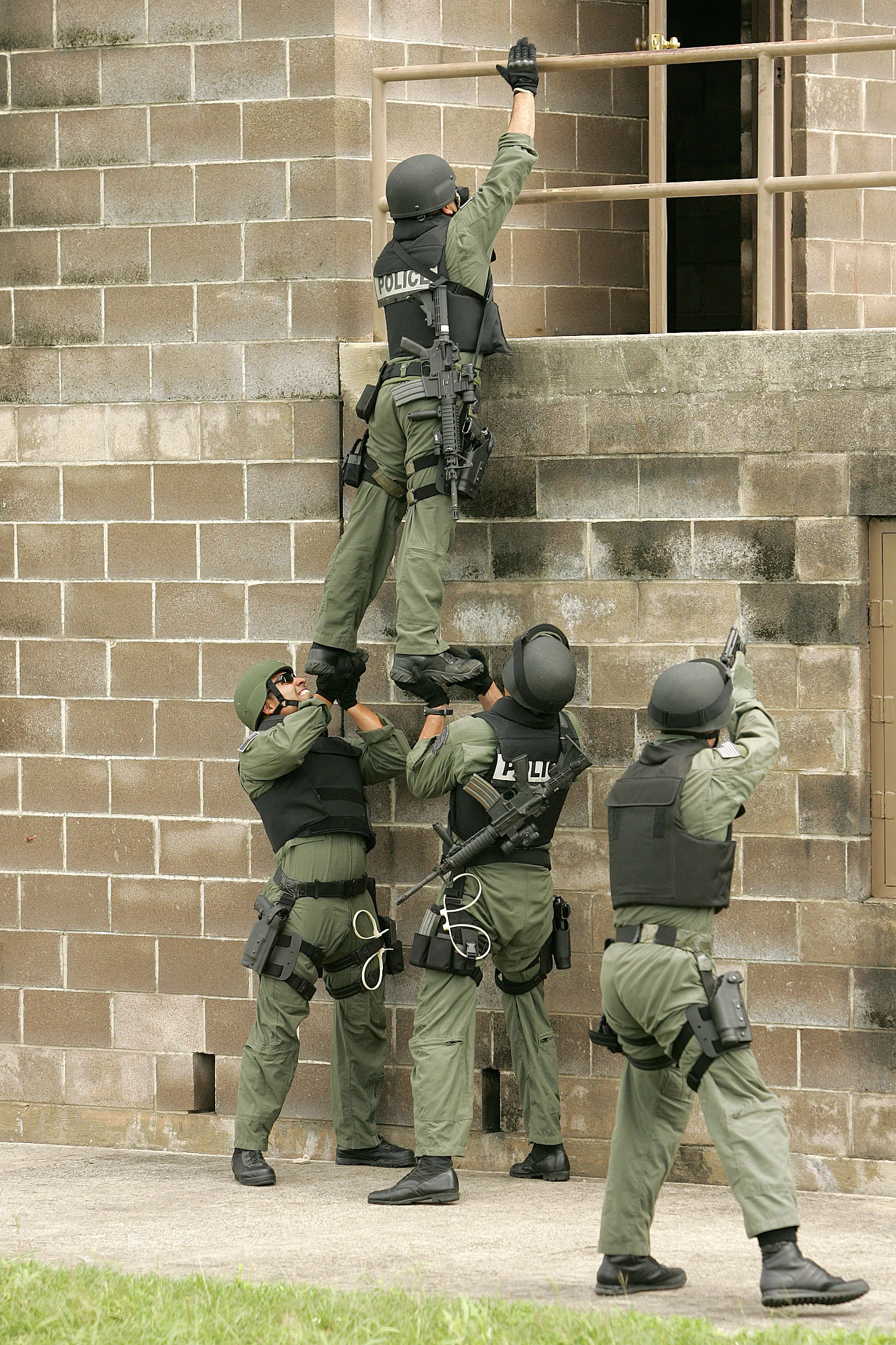 "Members of the 37th Training Wing's Emergency Services Team at Lackland AFB" by U.S. Air Force. Photo by Robbin Cresswell.