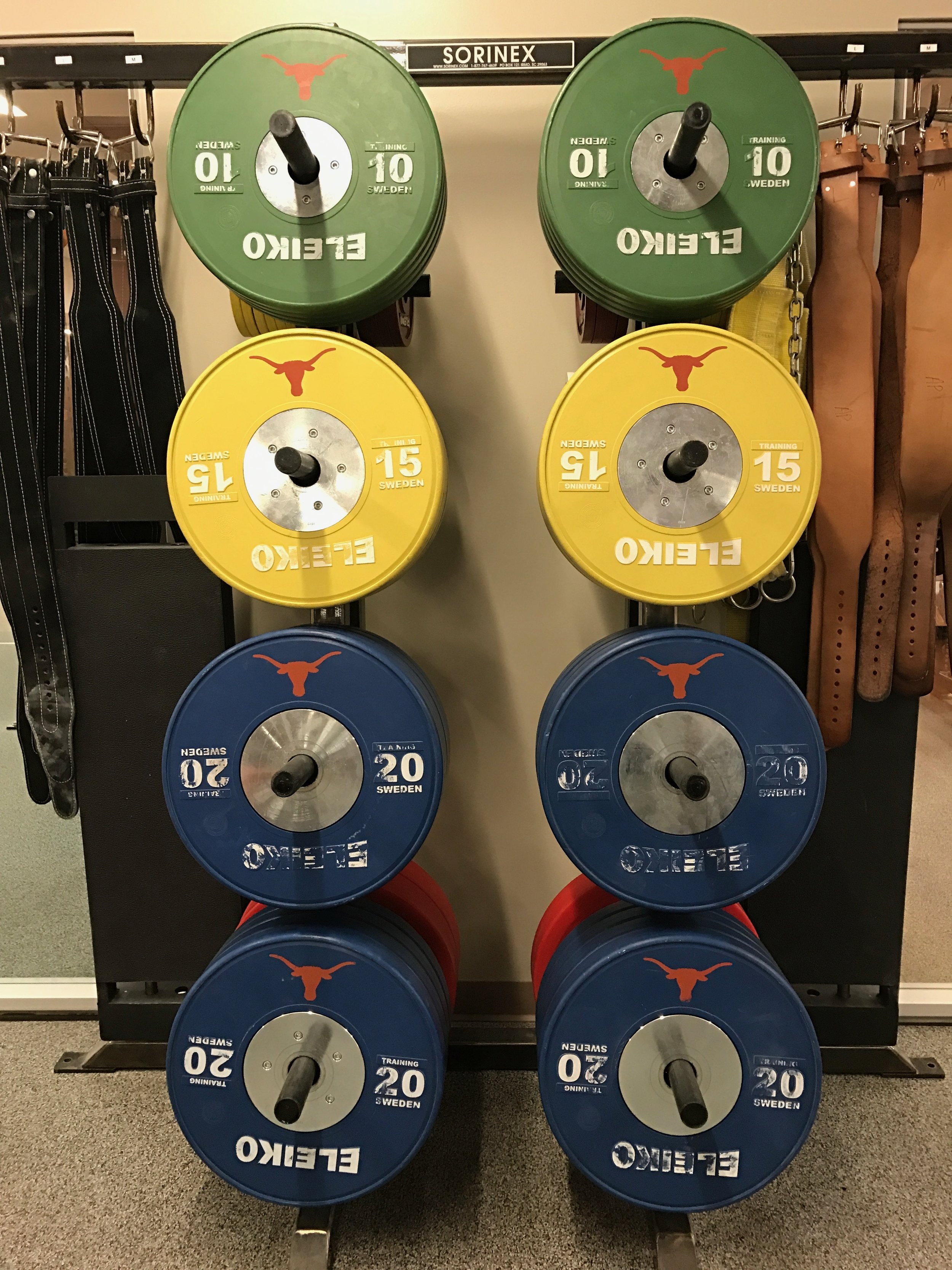 Plates and belts in the UT weight room.