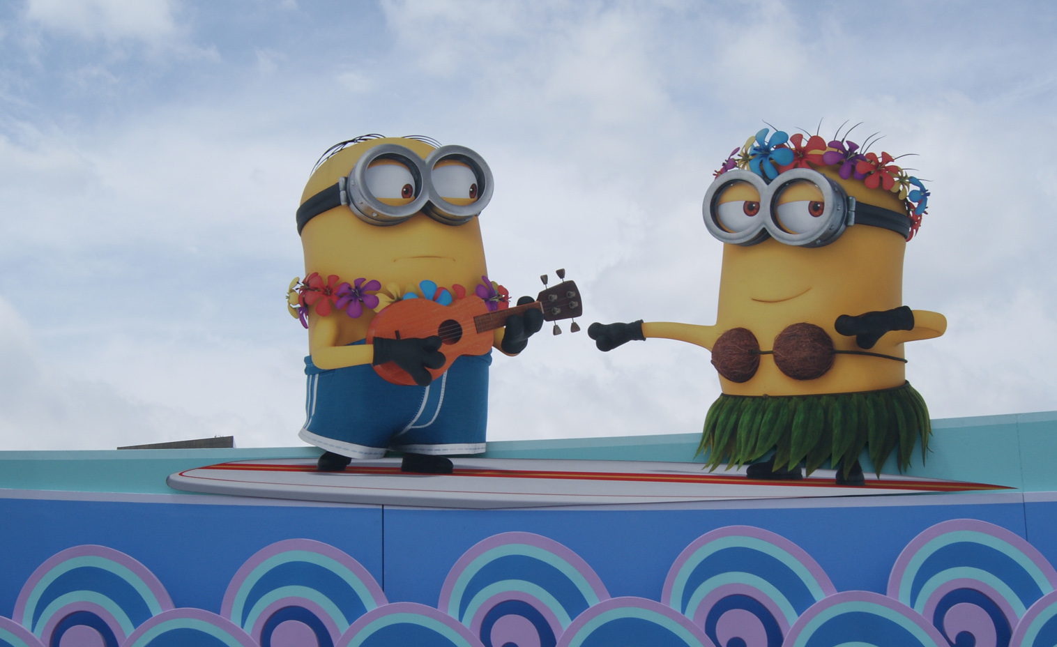 Minions. Printed digitally on aluminum. We created the detailed laser cut lines for fabrication.