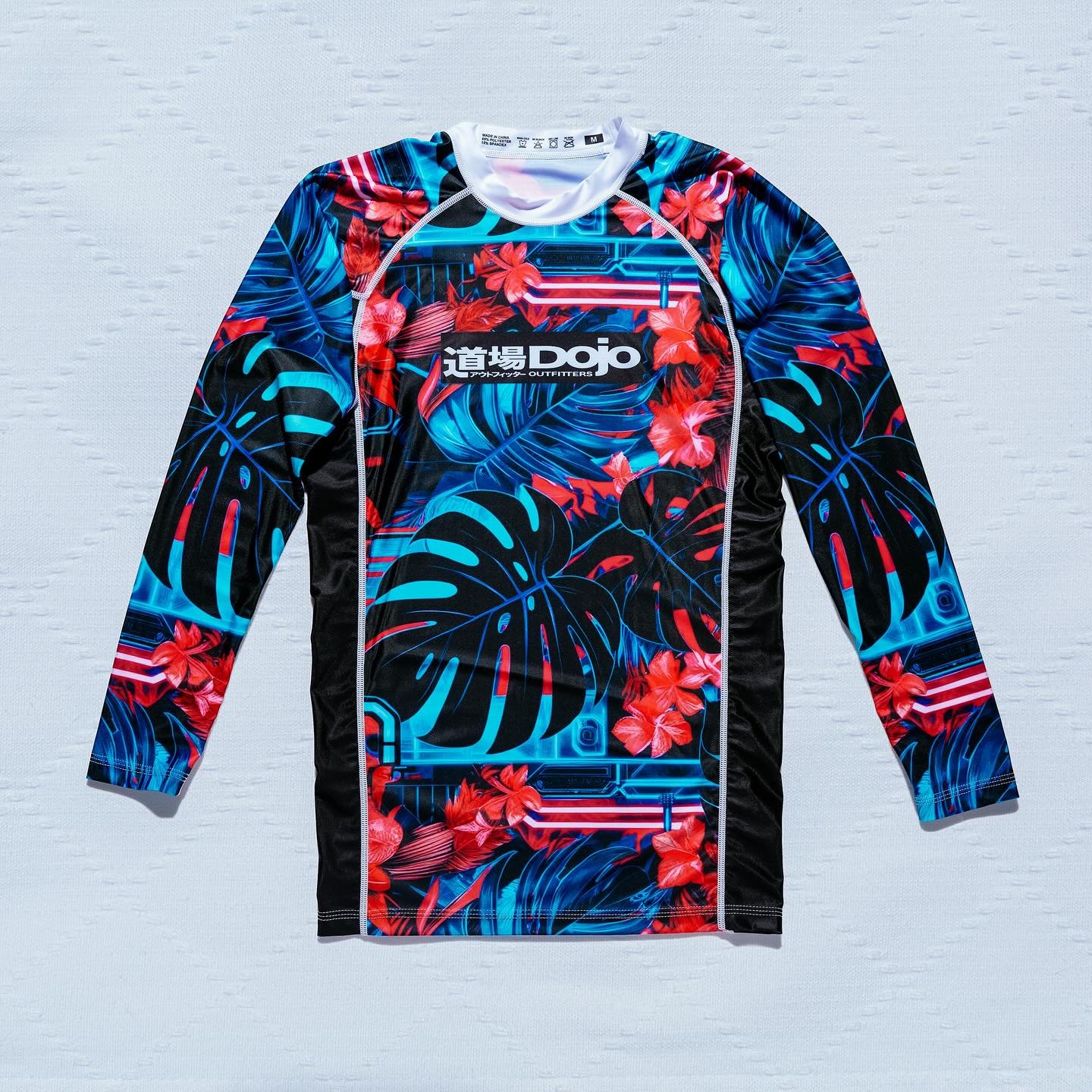 🍃 Where the cyber future meets the tatami mat, perfectly timed for Summer.
.
Our upcoming long-sleeve rashguard and fight short fuses cyberpunk grit with tropical heat&mdash;engineered for no-gi grappling, built to keep you cool, covered, and combat