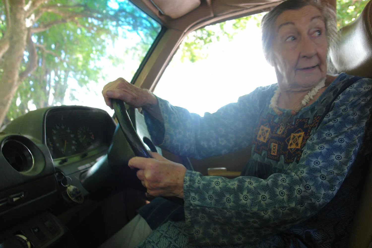 Topsi Venter in her old Mercedes Benz